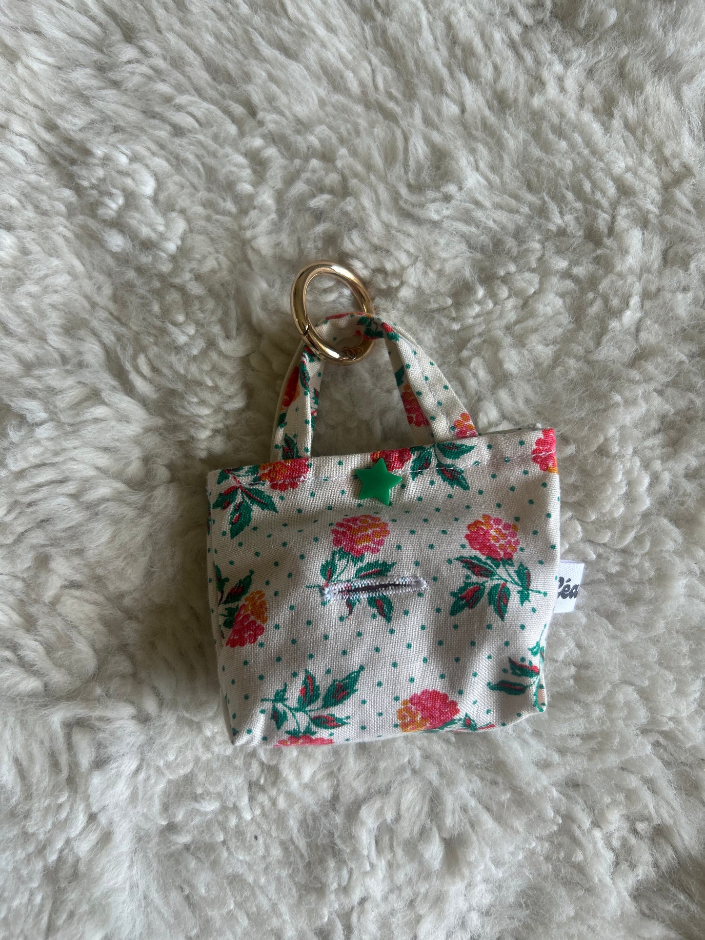 Poop bag blanc à pois fleuri
