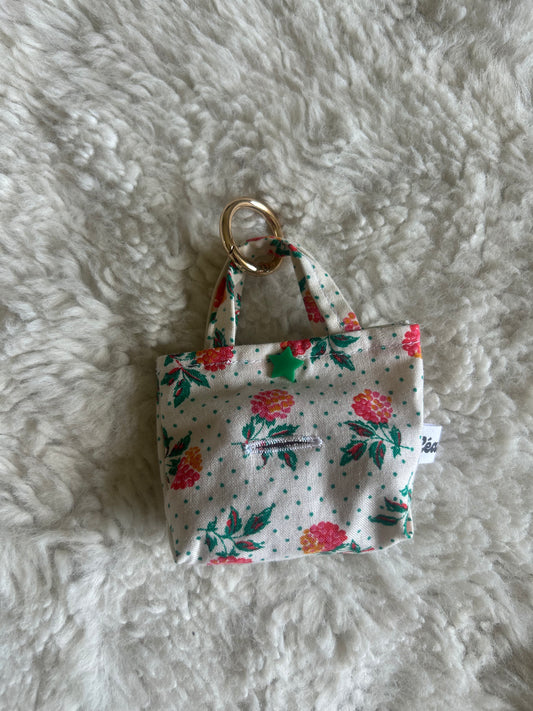 Poop bag blanc à pois fleuri