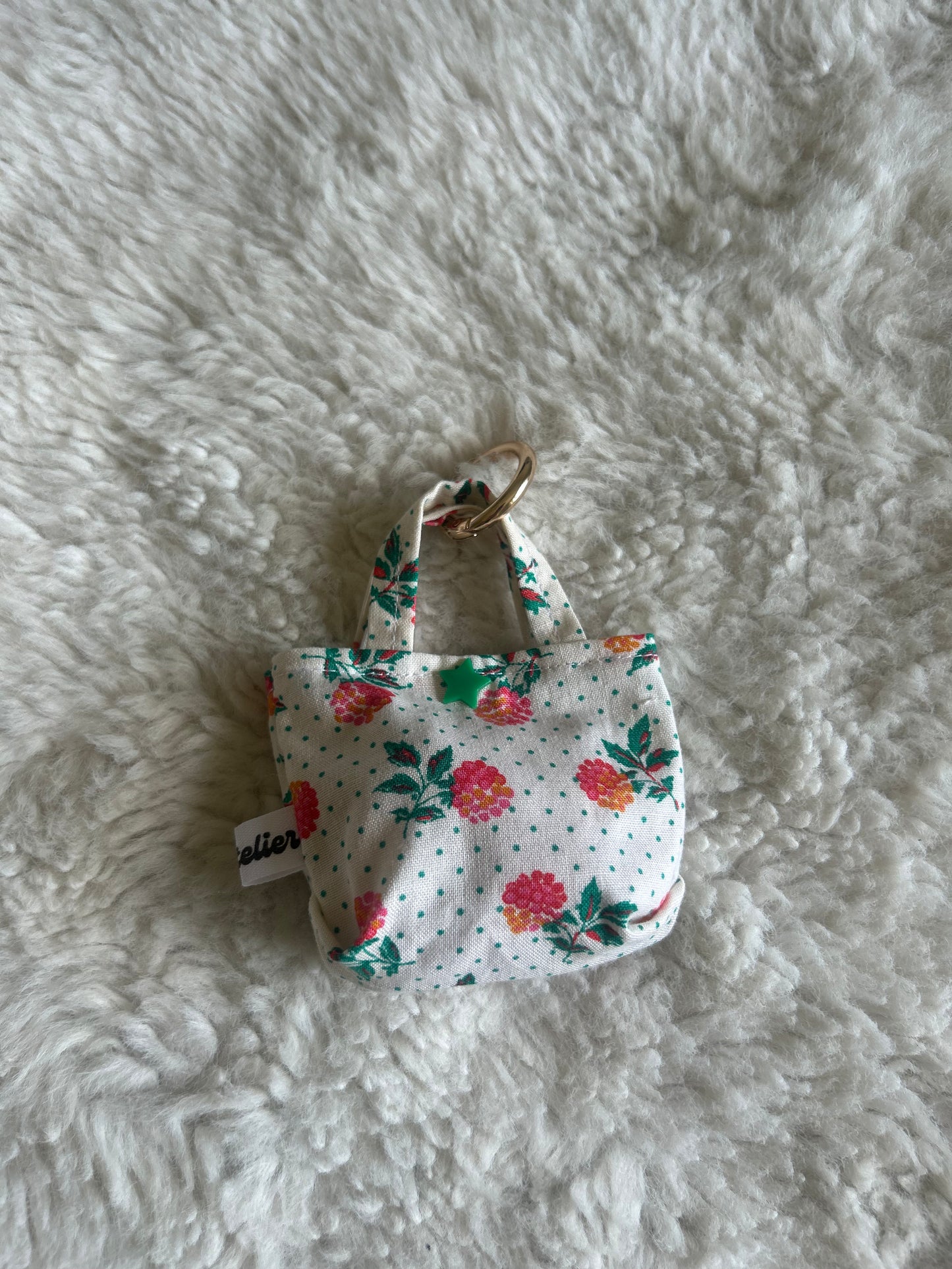Poop bag blanc à pois fleuri