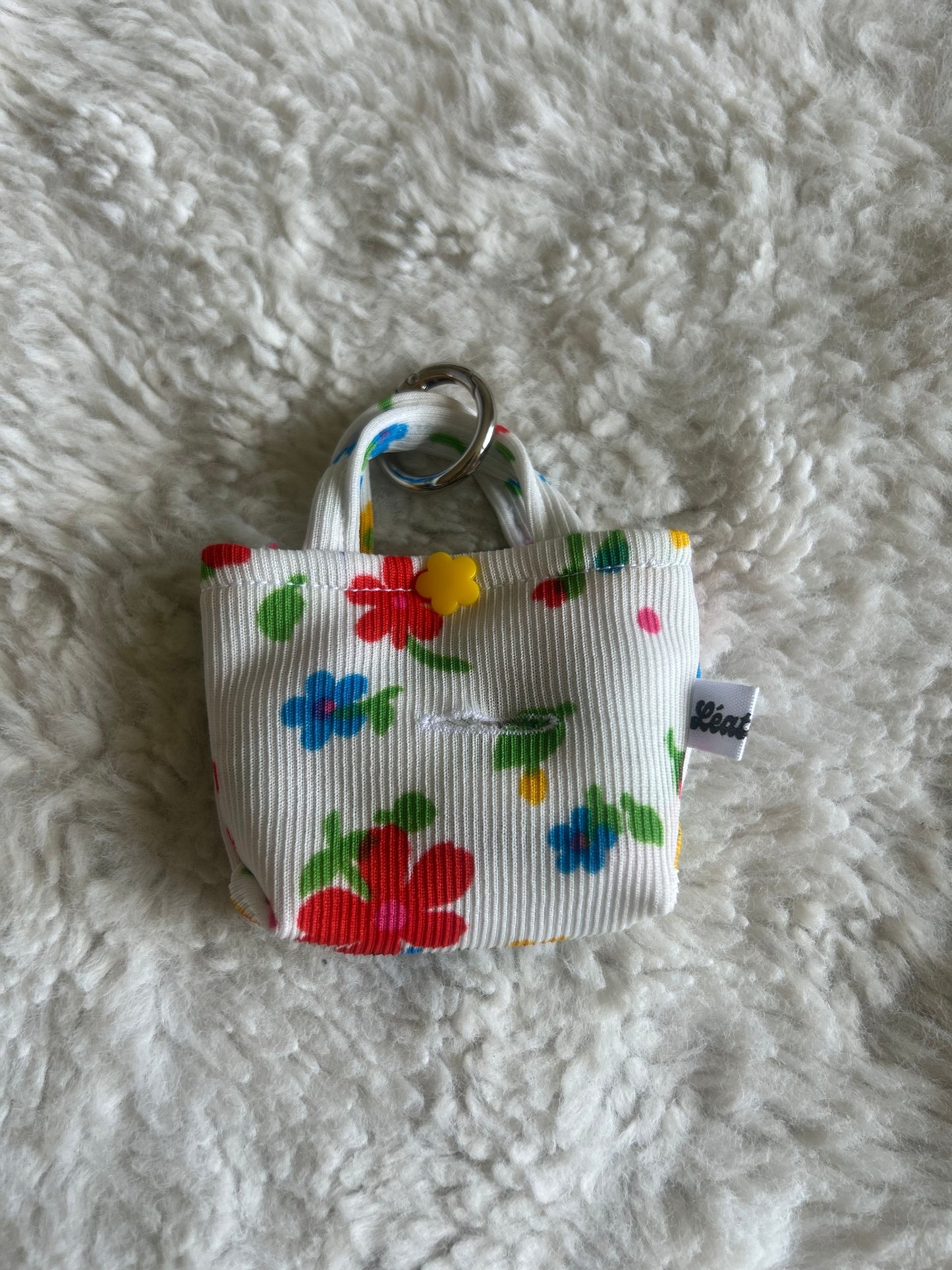 Poop bag blanc fleuri coloré