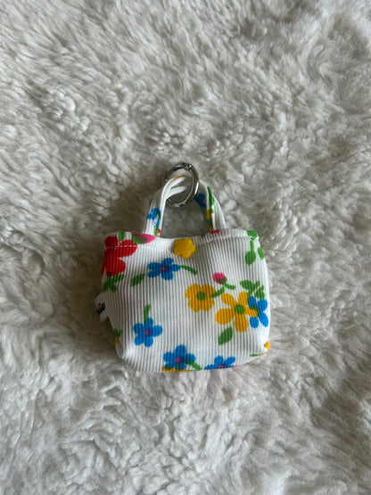 Poop bag blanc fleuri coloré