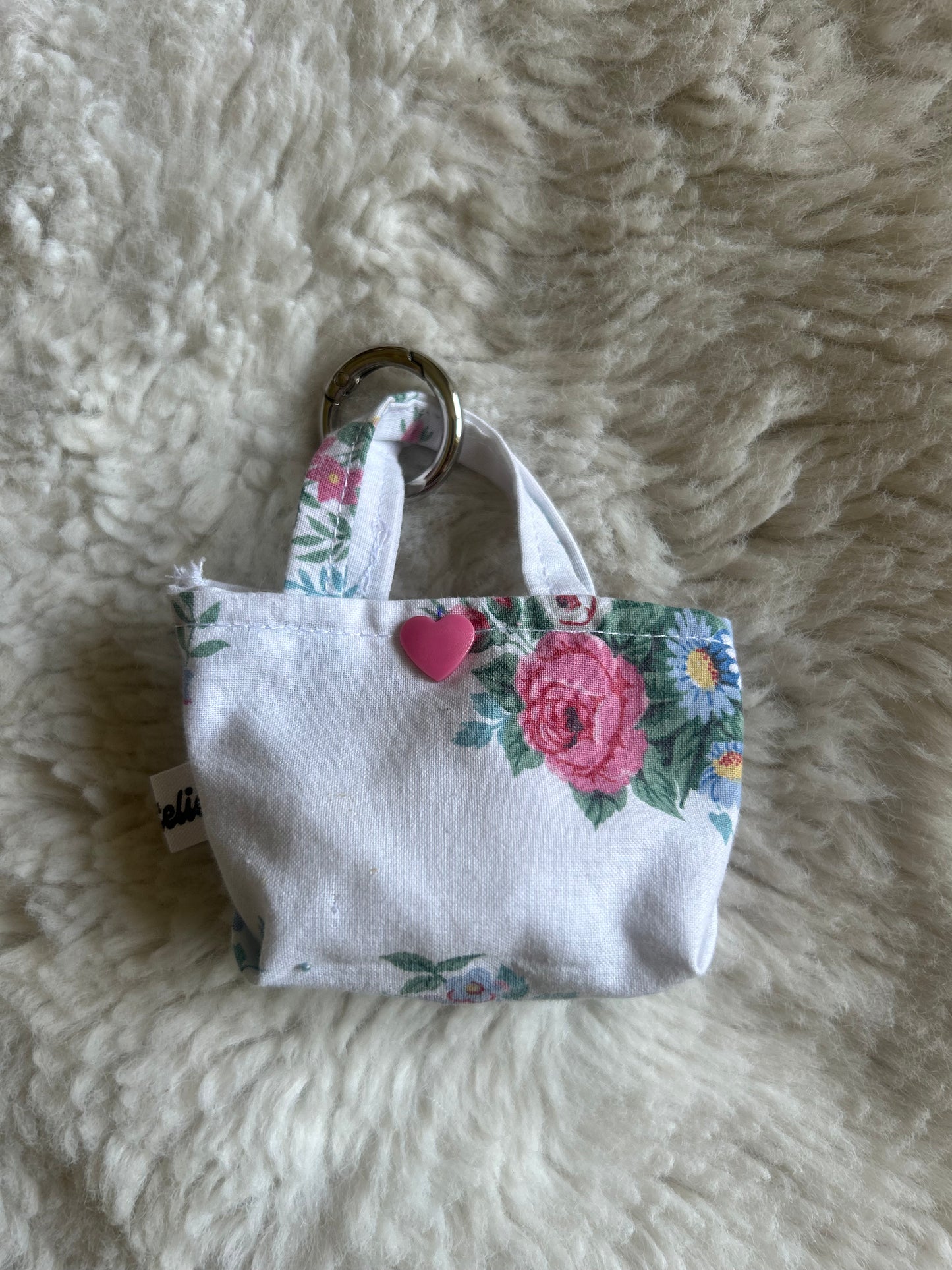 Poop bag blanc et fleuri