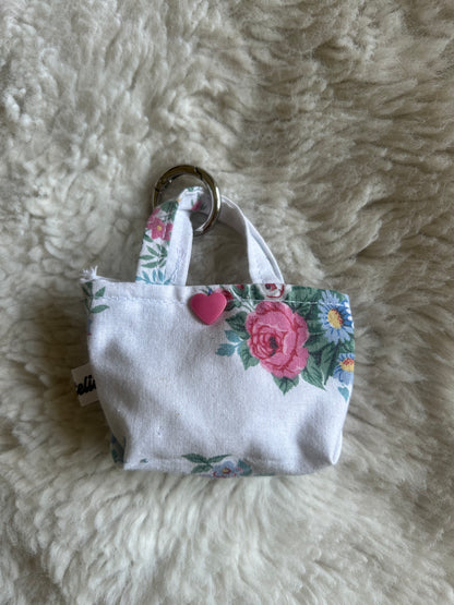 Poop bag blanc et fleuri