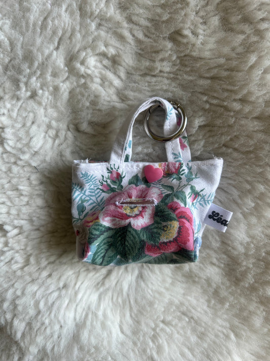 Poop bag blanc et fleuri